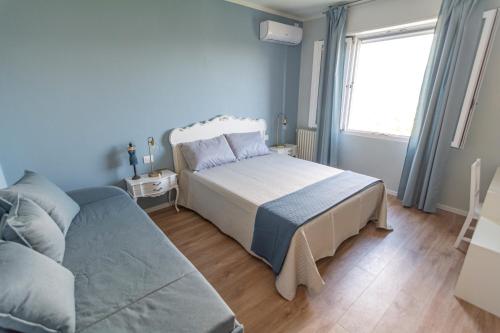 Postel nebo postele na pokoji v ubytování LE CAMERE DI MARIO