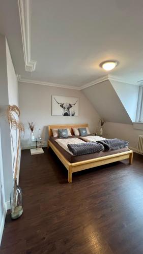 a bedroom with a large bed in a attic at Ferienwohnung Nr. 9 in Borkum