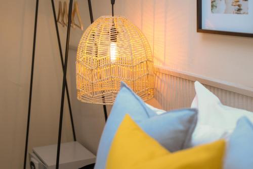 a lamp and some pillows in a room at Magnolia Inn in Panama City