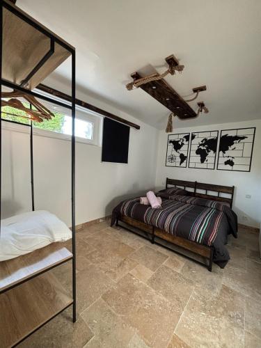 a bedroom with a bed in a room at Chez Duch' in Mably