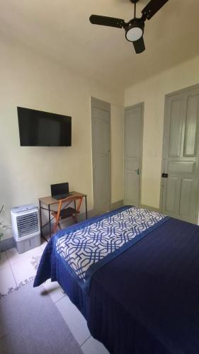 Postel nebo postele na pokoji v ubytování Casa Caminhos de Ubá