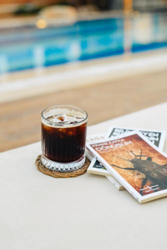 a cup of coffee sitting on a table at Mandalin Glamping in Selcuk
