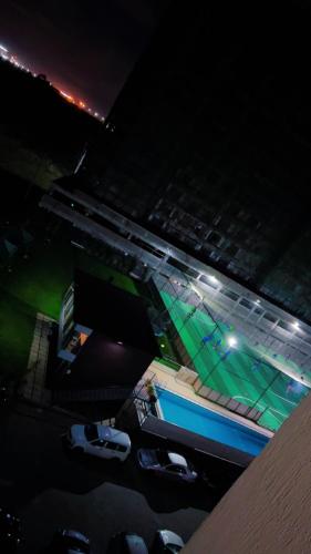 an aerial view of a swimming pool at night at Caster two bedrooms apartment jkia in Nairobi