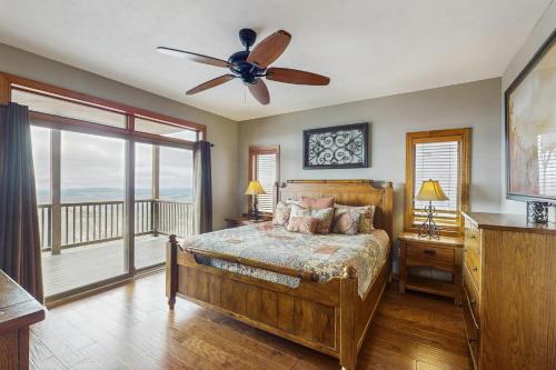 a bedroom with a bed and a ceiling fan at Reserve 19-D in Sugar Mountain