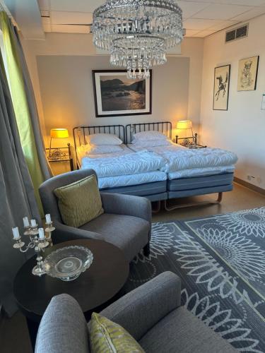 Cama o camas de una habitación en Esplanadens vandrarhem i Oxelösund