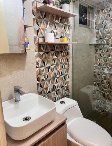 a bathroom with a sink and a toilet at Max House 503 in Soledad