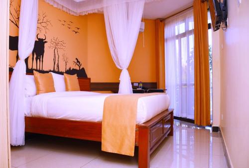 Postel nebo postele na pokoji v ubytování Divine Homes Resort Kisumu