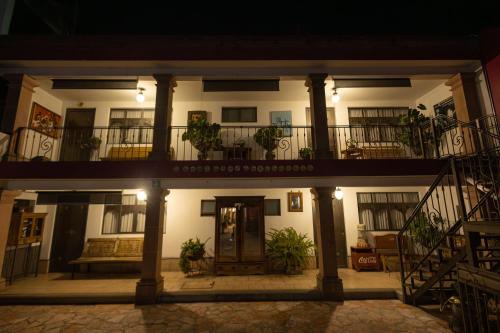an apartment building with a balcony and a door at Hotel-Boutique La Casa De Los Recuerdos in Zitácuaro