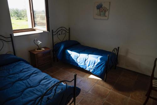 Cama o camas de una habitación en La Goccia D'oro