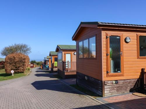 a row of tiny homes on a street at Daffodil Lodge in Ilfracombe