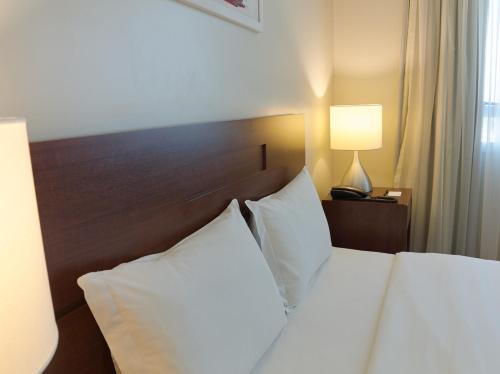 Postel nebo postele na pokoji v ubytování Bourbon Convention Hotel Ponta Grossa