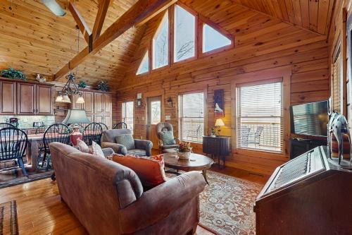 a living room with couches and a television in a cabin at Big Sky in Whittier