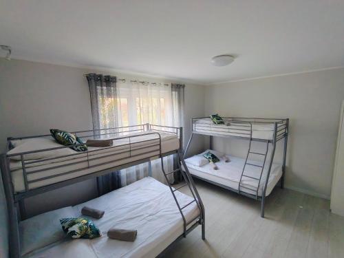 Posteľ alebo postele v izbe v ubytovaní Apartament Sumik