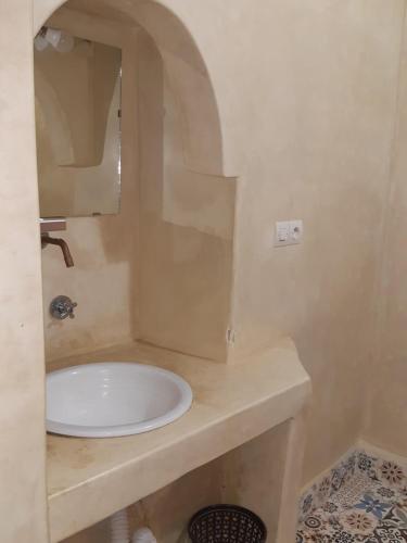 a bathroom with a sink and a mirror at Auberge De La Vallée in Imlil