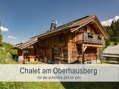 a small wooden house with the words chalk an olden house at Chalet am Oberhausberg, Region Schladming Dachstein in Haus im Ennstal