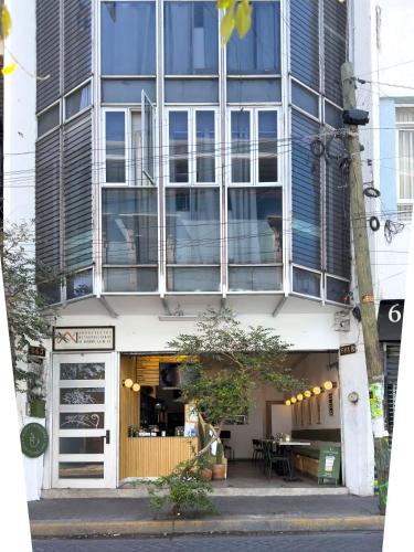 a building with a table in front of it at Estudios by Flor y tierra in Guadalajara