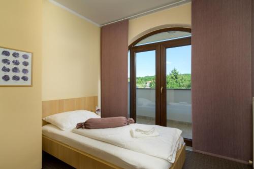 Ένα ή περισσότερα κρεβάτια σε δωμάτιο στο Penthouse Aurora