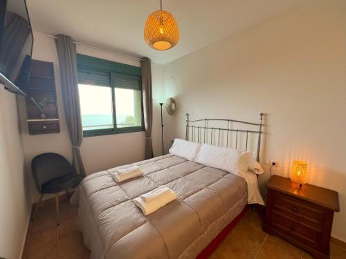 Ένα ή περισσότερα κρεβάτια σε δωμάτιο στο IRTA Sea View Apartment