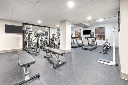 a gym with several exercise bikes and treadmills at Holiday Inn Express - Dallas Downtown by IHG in Dallas