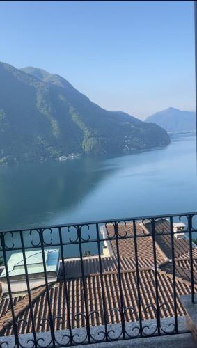 a view of a body of water from a balcony at Sweet View in Lugano