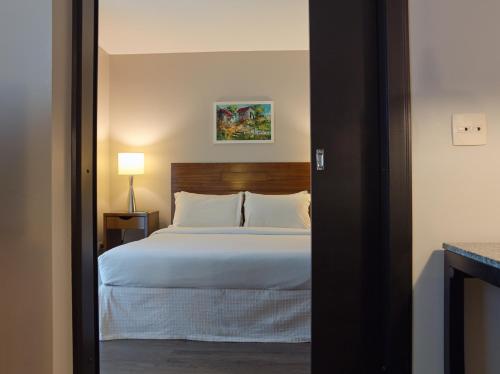 Postel nebo postele na pokoji v ubytování Bourbon Convention Hotel Ponta Grossa