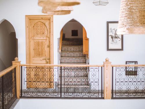 an entrance to a house with a wooden door at Riad Le Petit Joyau in Marrakech