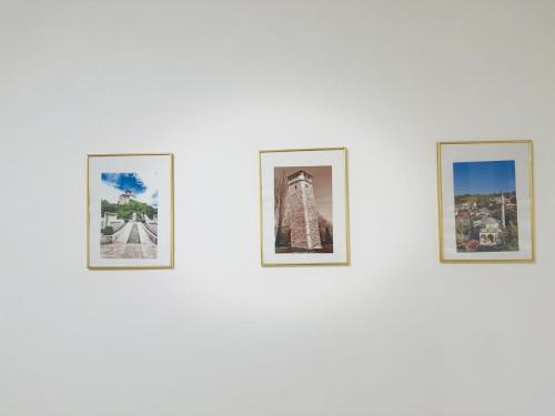 a group of four pictures on a wall at Old Town Heritage in Gradačac