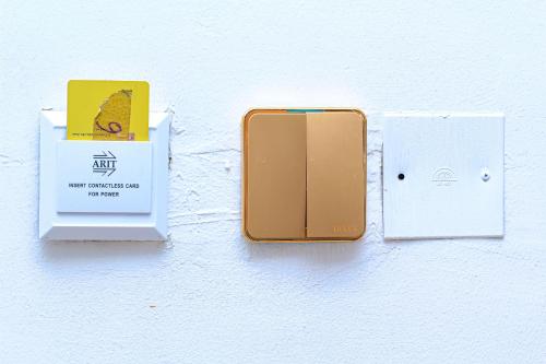 an open cell phone is plugged into a wall at Marquee Land Hotel in Lagos