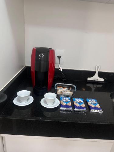 Kemudahan buat kopi dan teh di KIT Confortável em Águas Claras