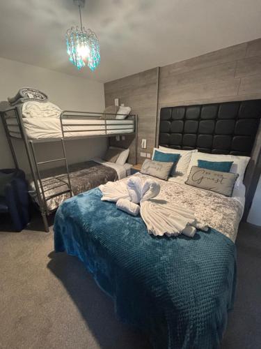 a bedroom with two bunk beds with towels on a bed at Kings Boutique Hotel in Blackpool