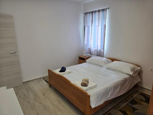 Ένα ή περισσότερα κρεβάτια σε δωμάτιο στο Apartments Sanja