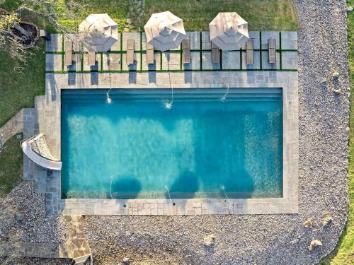 an overhead view of a swimming pool at Lazy River Ranch - Lazy River Pool, Golf & Pickleball in Kreutzberg