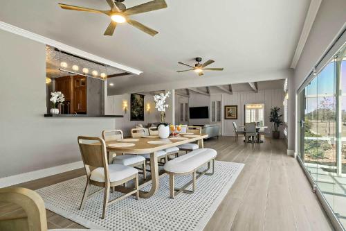 a dining room and living room with a table and chairs at Lazy River Ranch - Lazy River Pool, Golf & Pickleball in Kreutzberg