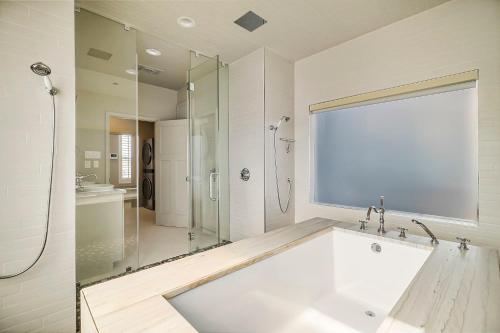 a white bathroom with a tub and a shower at Lazy River Ranch - Lazy River Pool, Golf & Pickleball in Kreutzberg