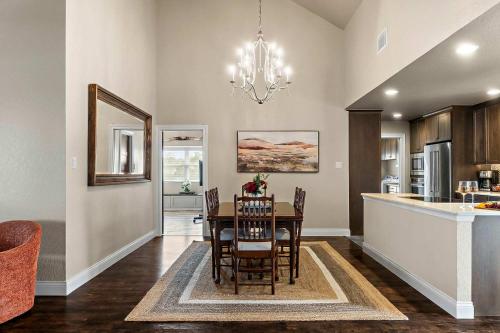 a dining room and kitchen with a table and chairs at Lazy River Ranch - Lazy River Pool, Golf & Pickleball in Kreutzberg