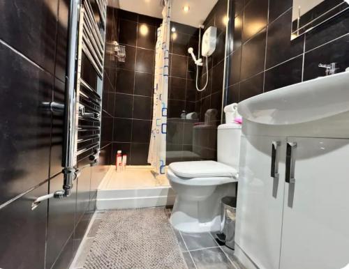 Koupelna v ubytování Quarto 5 casa compartilhada no L6