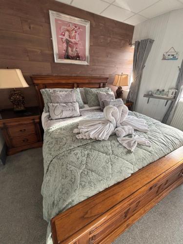 a bedroom with a large bed with towels on it at Kings Boutique Hotel in Blackpool