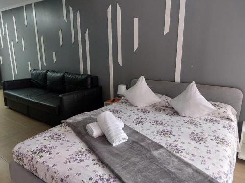 Un ou plusieurs lits dans un hébergement de l'établissement Optimus Comfort