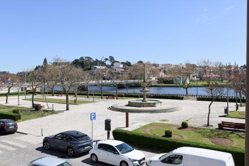 a group of cars parked in a parking lot at Margens do Rio in Vila do Conde