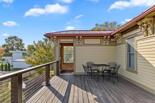a wooden deck with a table and chairs on it at Douglas Retreat in Douglas