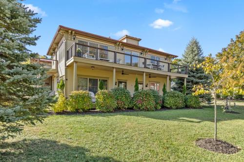 a large yellow house with a large yard at Douglas Retreat in Douglas