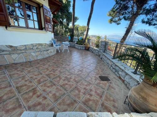 a patio with a view of the water at pines & sea in Sofiko