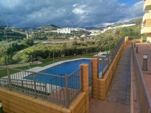 a swimming pool on the balcony of a building at La Dehesa in Torrox