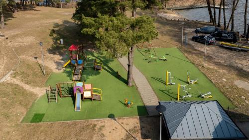 an overhead view of a park with a playground at Domek na wodzie - Marina & Camping Siemiany in Siemiany