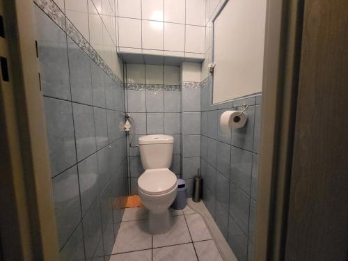a bathroom with a toilet in a small room at Błękit Bałtyku in Łazy