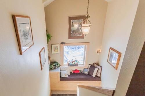 a living room with a couch and a window at Bear Lake Lodgings B&B, Inc in Seward