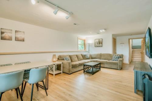 a living room with a couch and a table at Koselig Cottage on Medicine Lake in Minneapolis