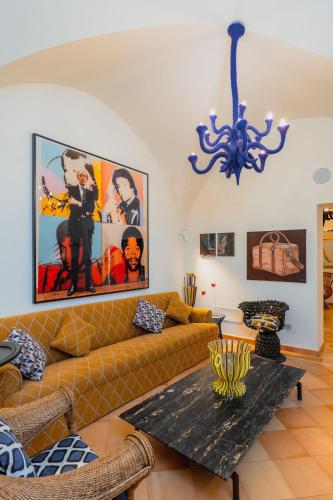 a living room with a couch and a table at Five Positano in Positano