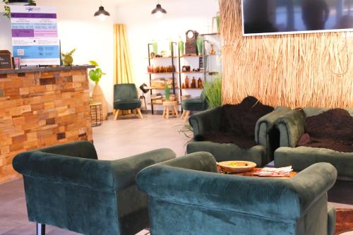 a living room with two couches and a table at Stargaze Home Hotel in Haan