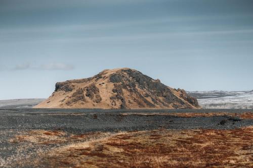 a sand mound in the middle of a desert at Eyja Mork - Stargazing Igloo with shared Hot Tub, BBQ and kitchen - B3 in Stora Mork